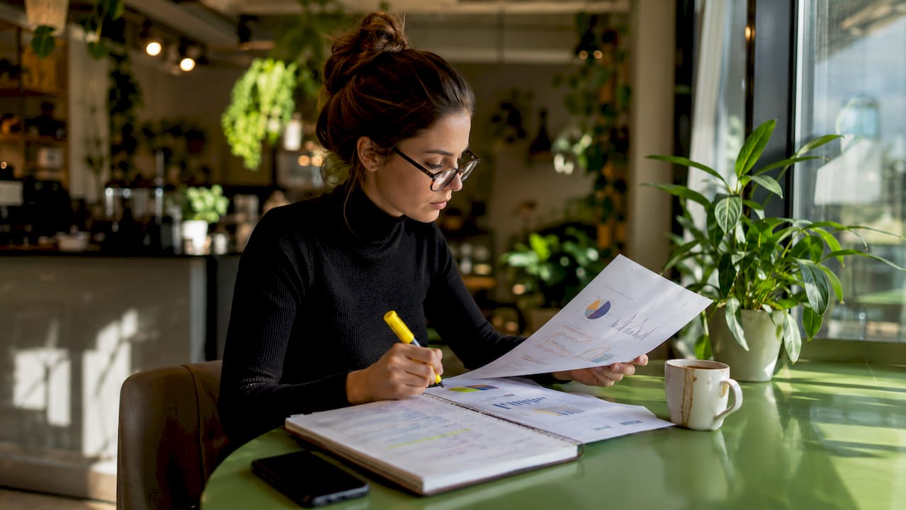 Marketer analyzing semantic search reports at home office